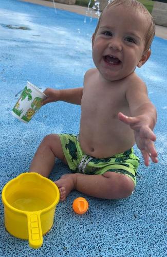 20220609-Isaiah-at-splash-pad-2-Sugar-Bottom-IA