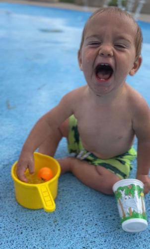 20220609-Isaiah-at-splash-pad-Sugar-Bottom-IA