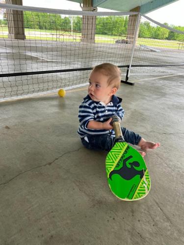 Isaiah-playing-pickle-ball-lake-tawakoni