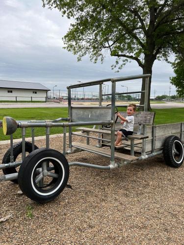 20220520-Keahi-playing-on-the-old-truck-Kalona-Park